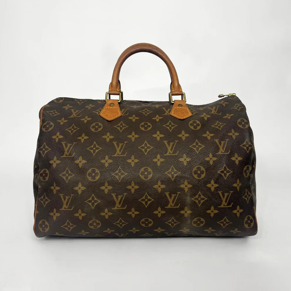 Brown Louis Vuitton bag with monogram pattern on a white background