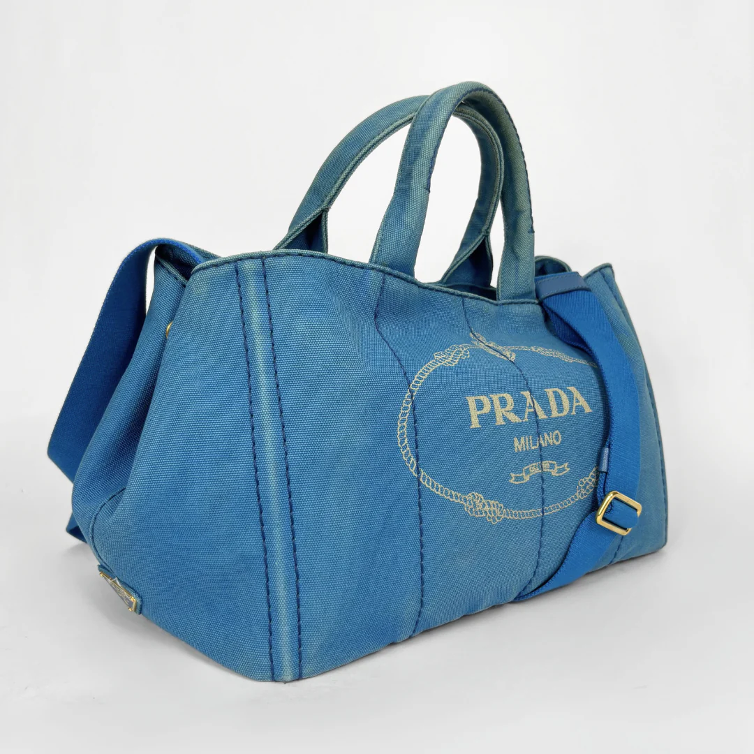 Blue Prada handbag on a white background