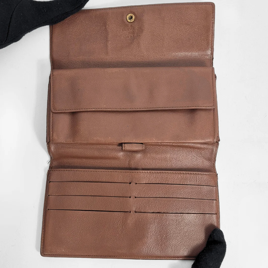 Brown leather wallet on a white background