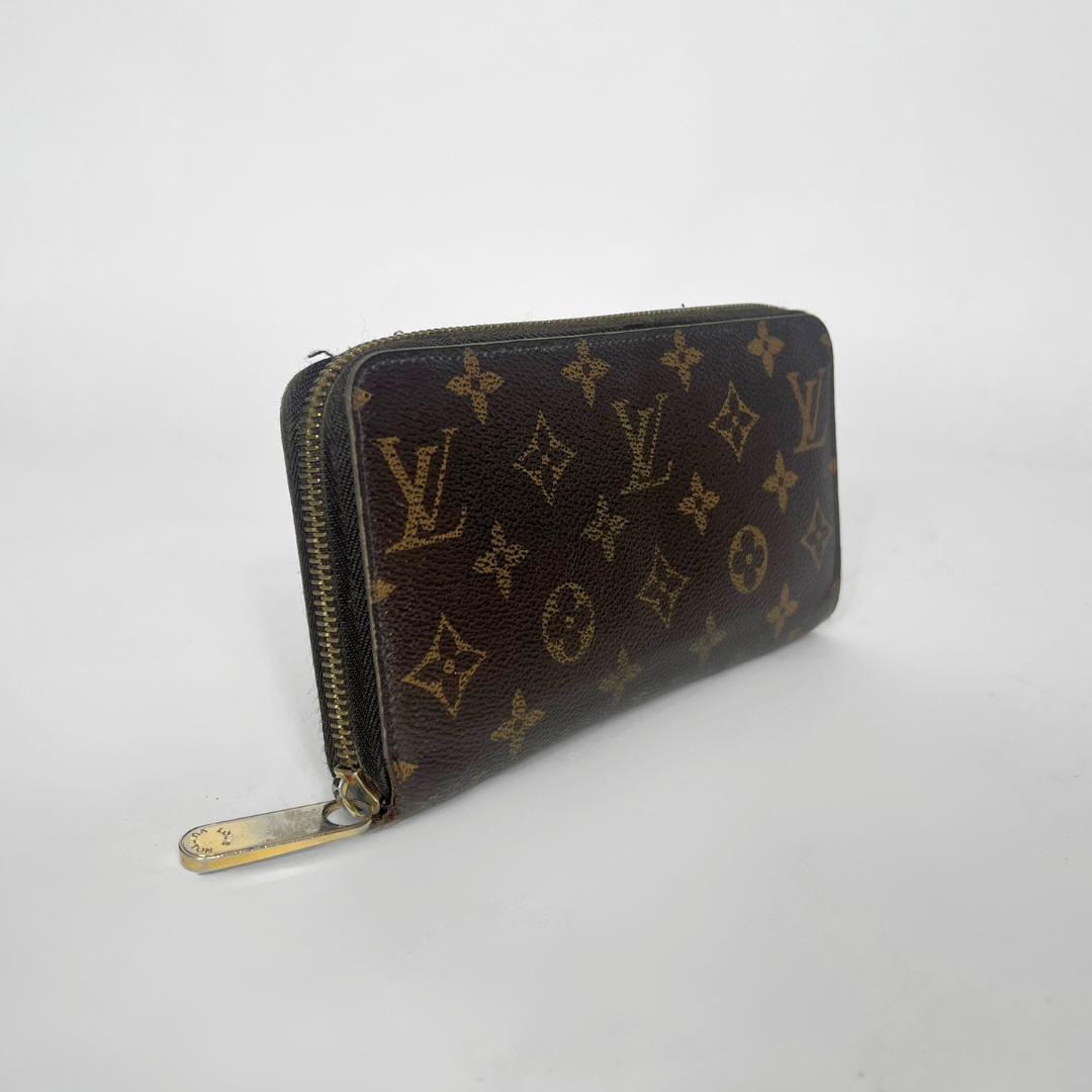 Designer wallet with monogram pattern on a white background