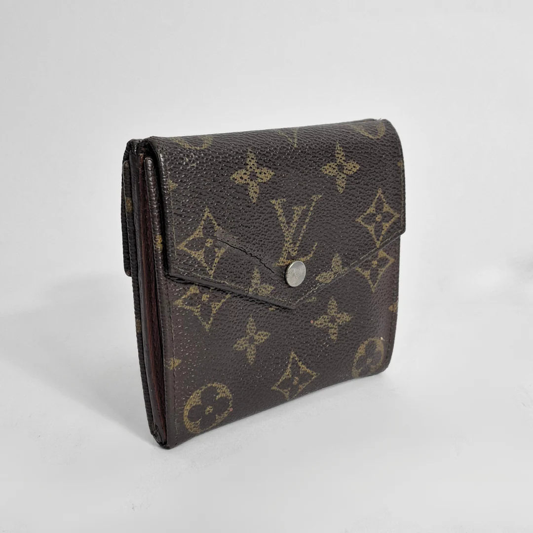 Louis Vuitton wallet with monogram pattern on a white background