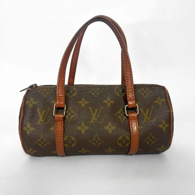 Brown handbag with tan leather straps on a white background