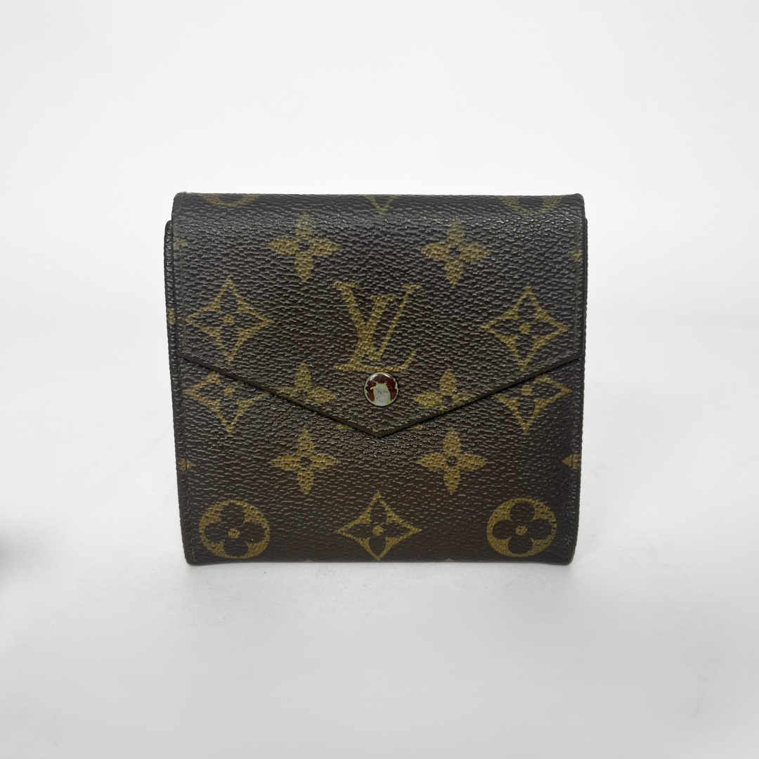 Louis Vuitton wallet with monogram pattern on a white background