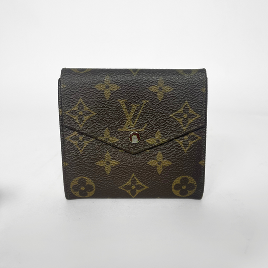 Louis Vuitton wallet with monogram pattern on a white background