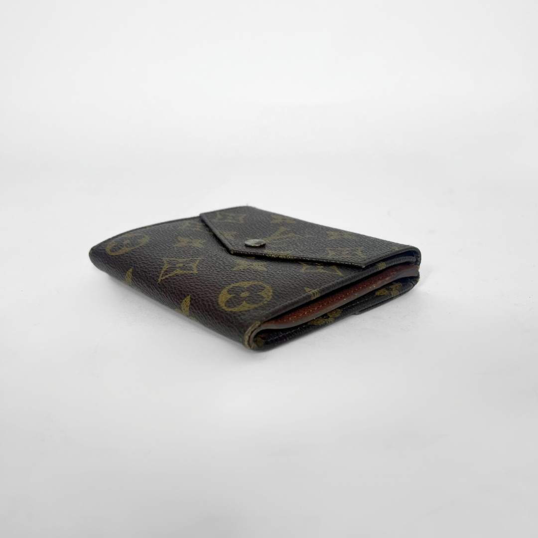 Vintage wallet with monogram pattern on a white background