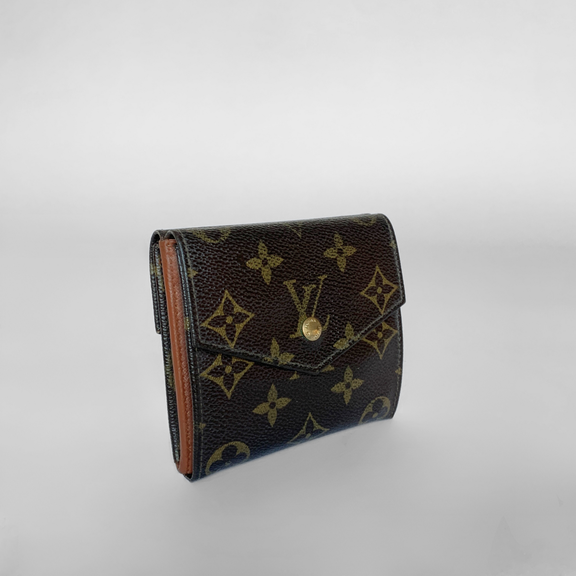 Louis Vuitton wallet with monogram pattern on a light gray background