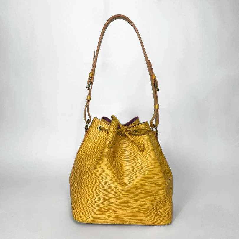 Yellow handbag with brown handle on a white background