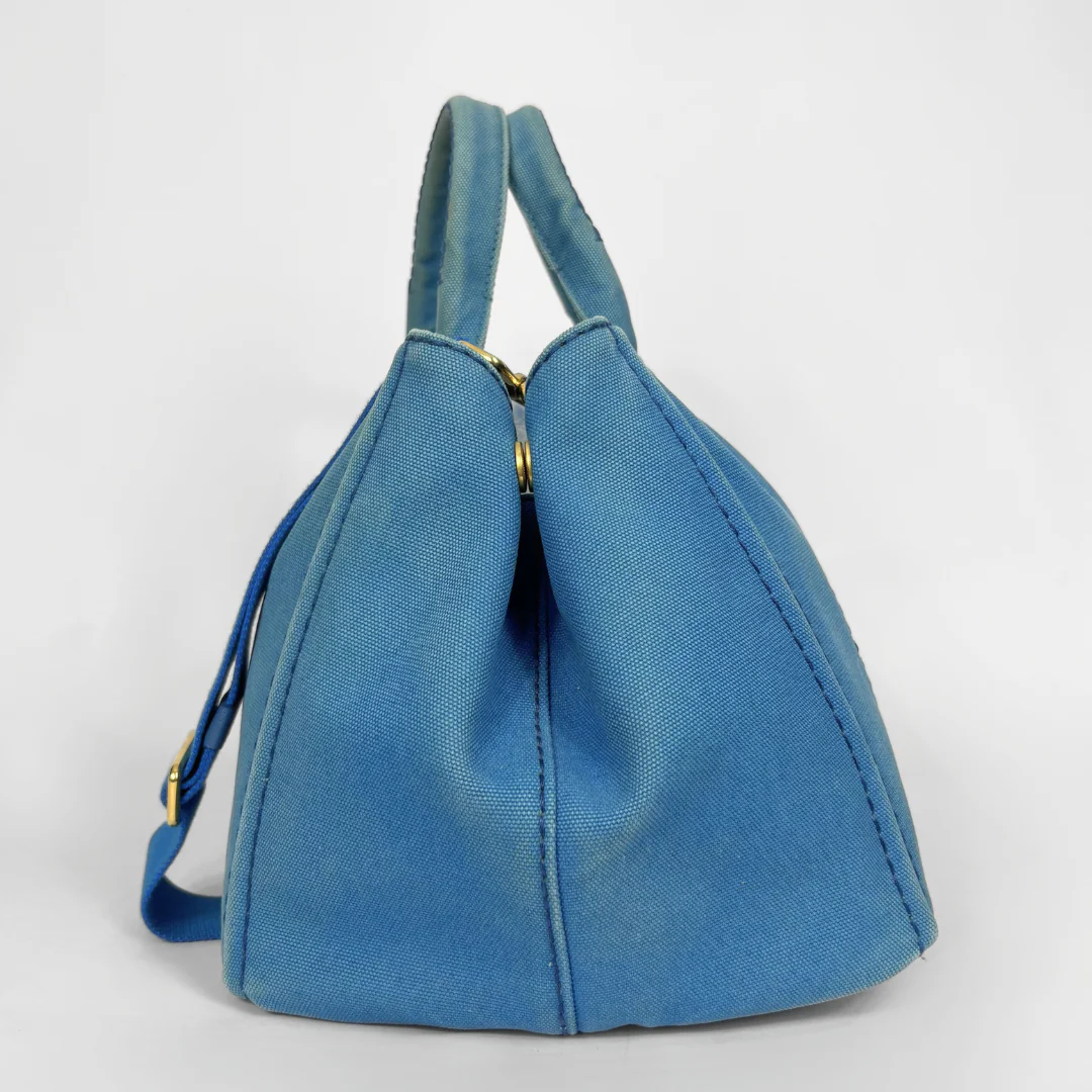Blue Prada handbag on a white background