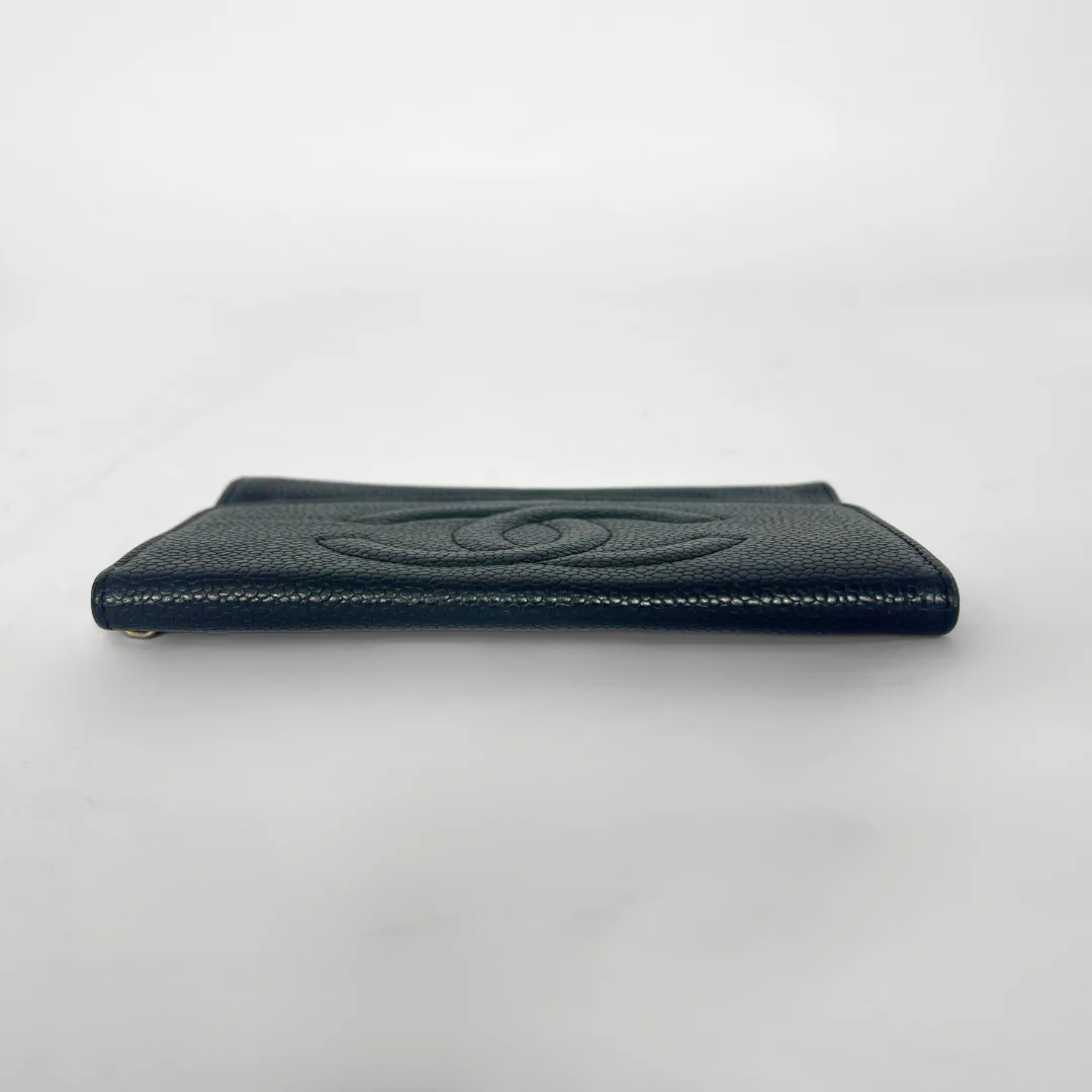 Dark green leather wallet with brand logo on a light gray background