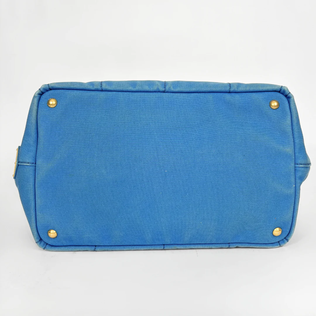 Blue Prada handbag on a white background