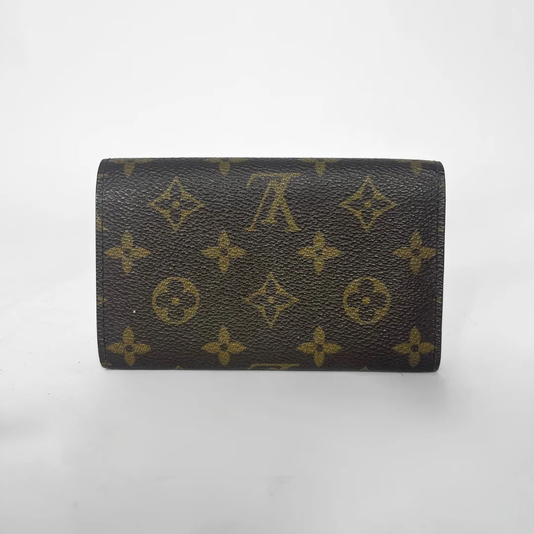Designer wallet with monogram pattern on a white background