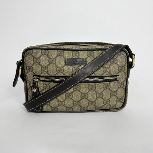 Gucci handbag with monogram pattern on a white background