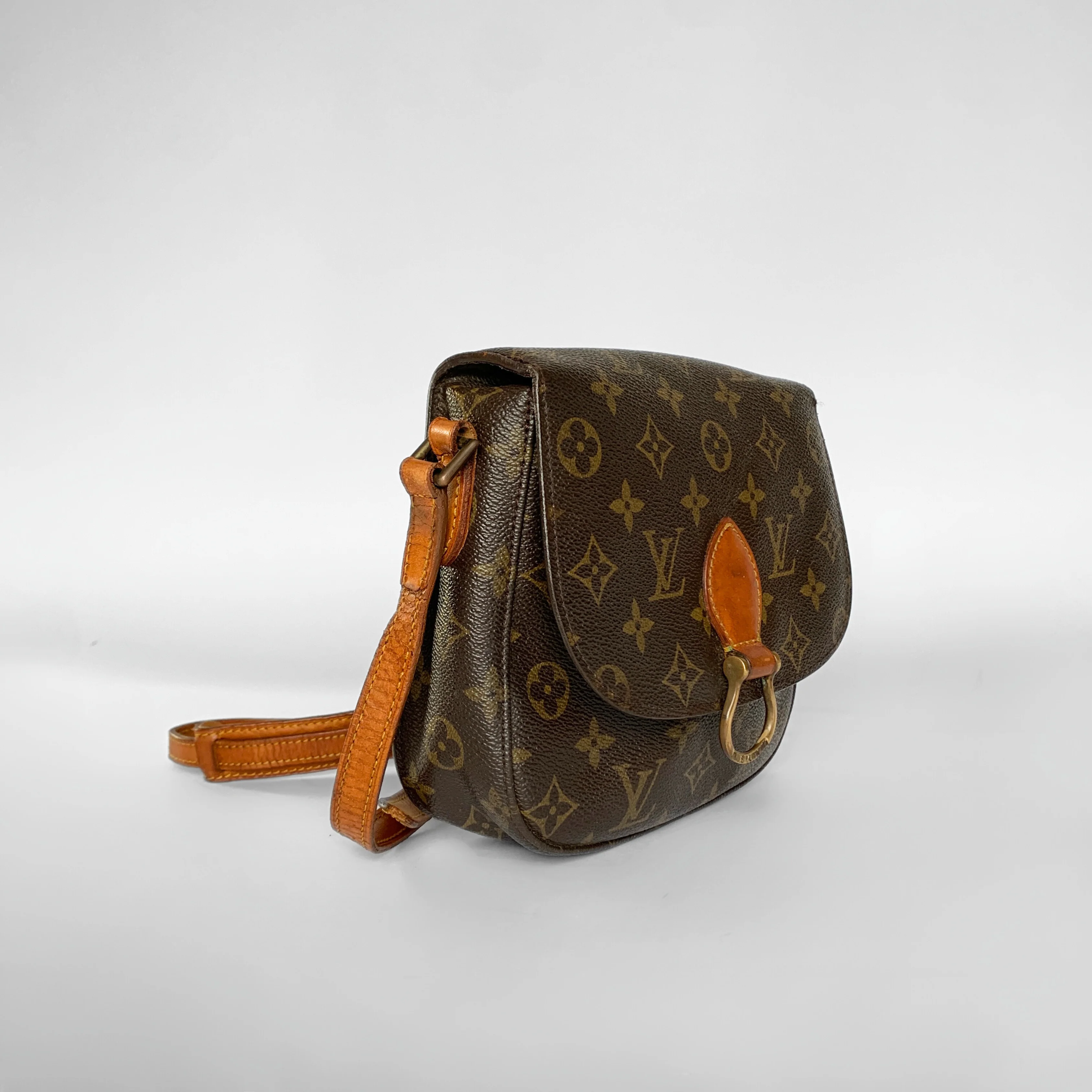 Brown leather handbag with orange accents on a white background