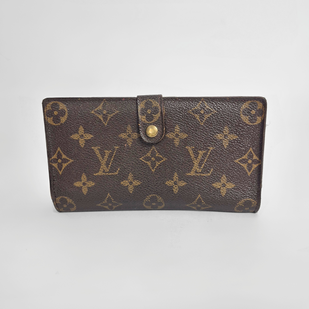 Louis Vuitton wallet with monogram pattern on a white background