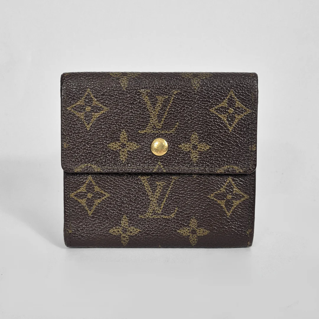 Louis Vuitton wallet with monogram pattern on a light gray background