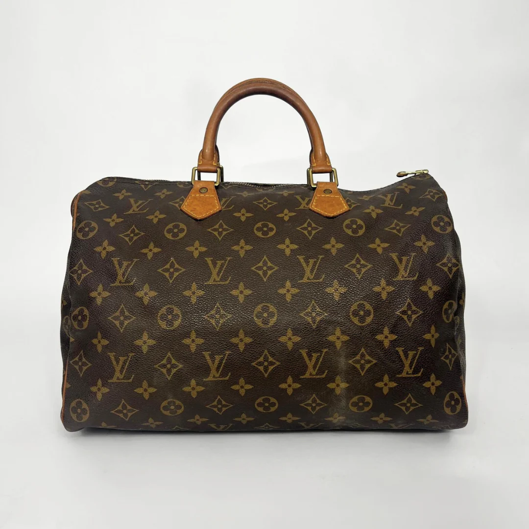 Brown Louis Vuitton bag with monogram pattern on a white background