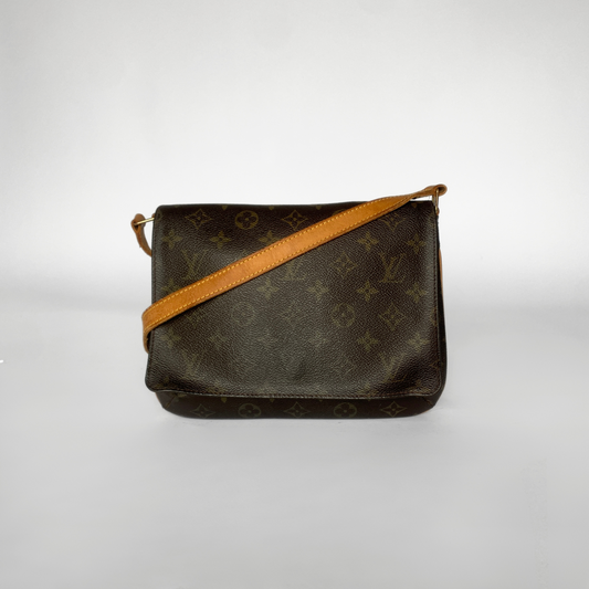 Designer handbag with monogram pattern and brown strap on a white background