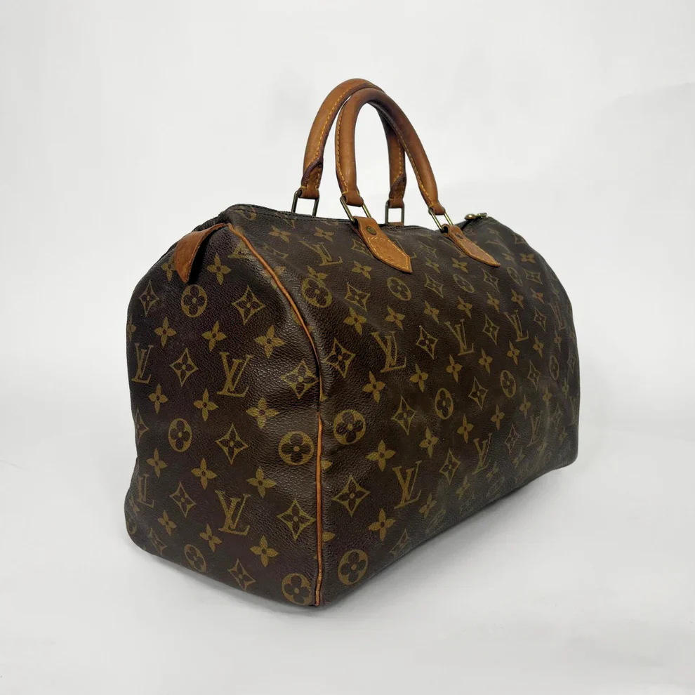 Brown Louis Vuitton bag with monogram pattern on a white background