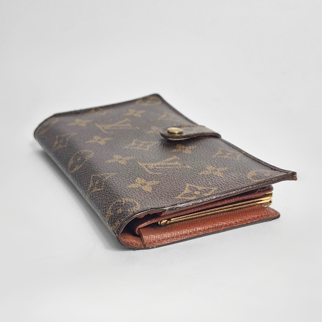 Brown leather wallet with gold accents on a light gray background
