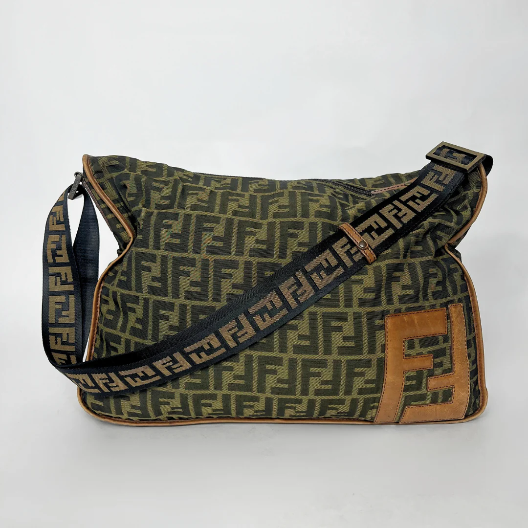 Green patterned bag with brown accents on a white background