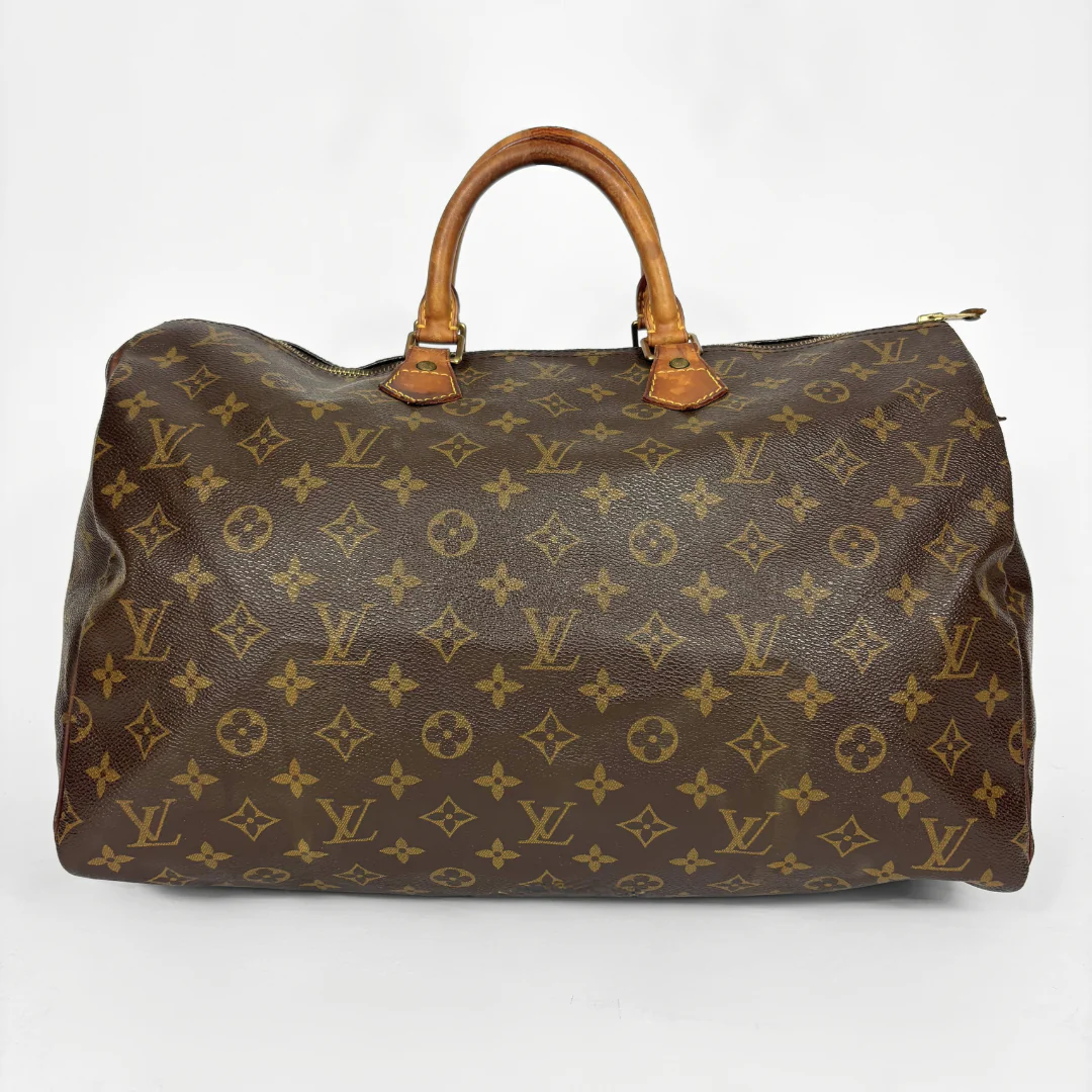 Brown Louis Vuitton bag with monogram pattern on a white background