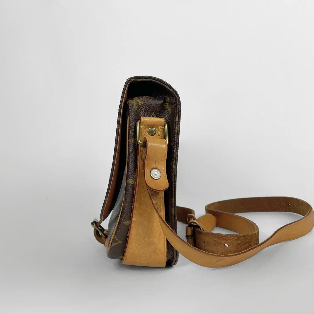A vintage Louis Vuitton shoulder bag in brown monogram canvas with tan leather trim and strap, shown from a side profile view on a light gray background.