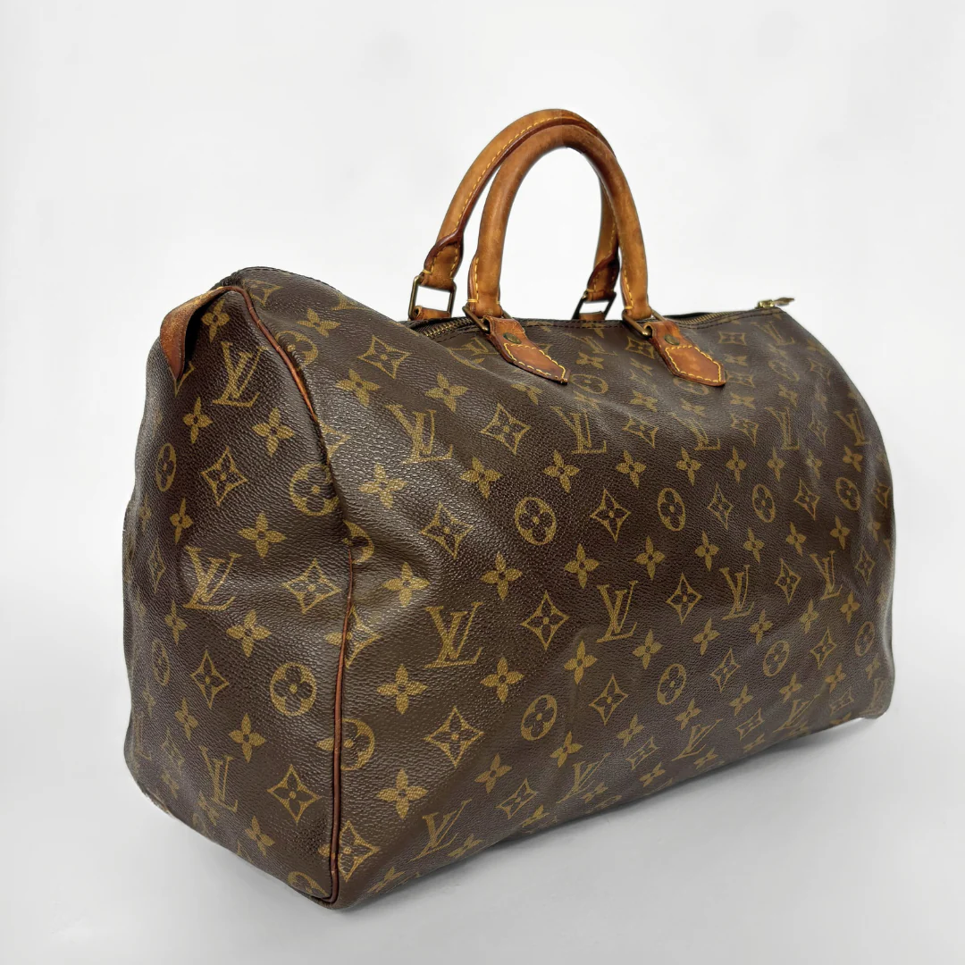 Brown Louis Vuitton bag with monogram pattern on a white background