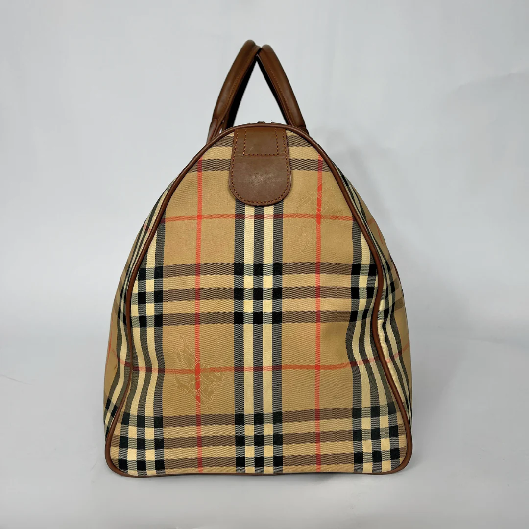 Plaid patterned bag with brown accents on a light gray background
