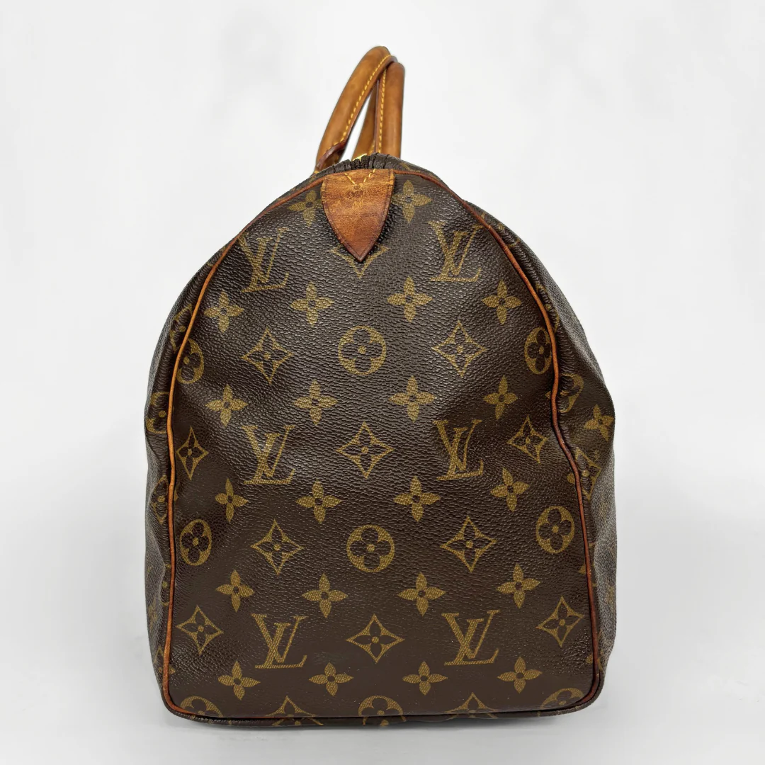 Brown Louis Vuitton bag with monogram pattern on a white background