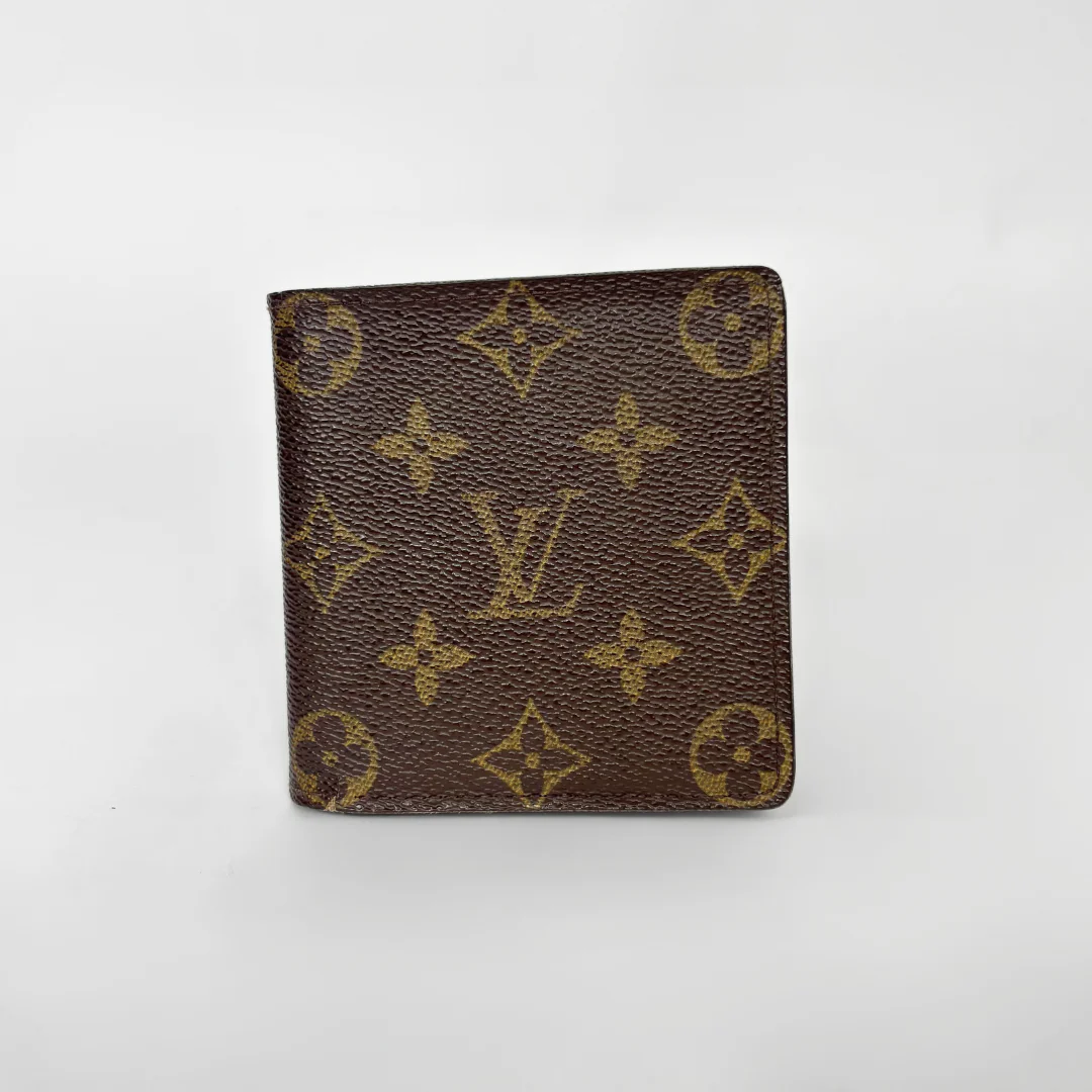 Louis Vuitton wallet with monogram pattern on a white background