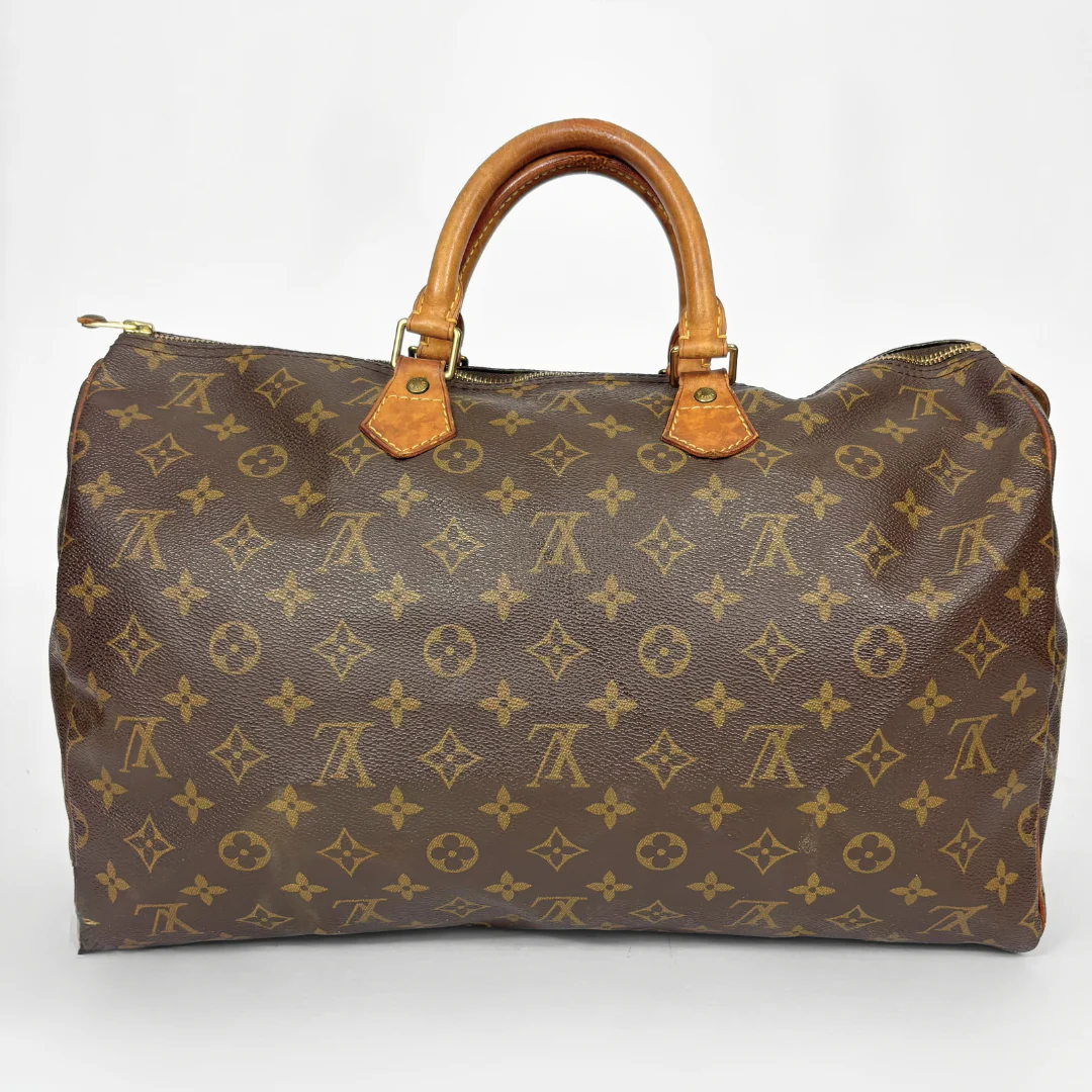 Brown Louis Vuitton bag with monogram pattern on a white background