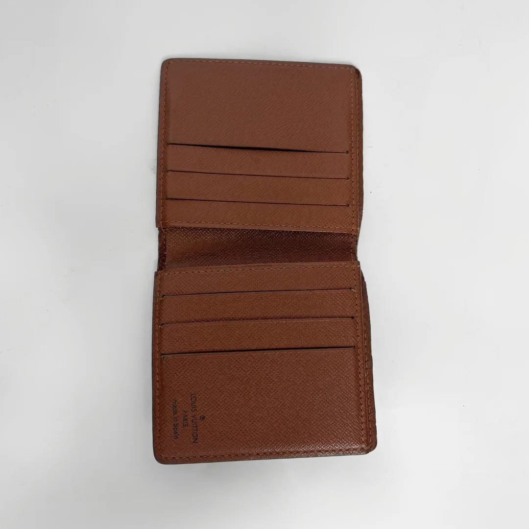 Brown leather wallet open on a white background