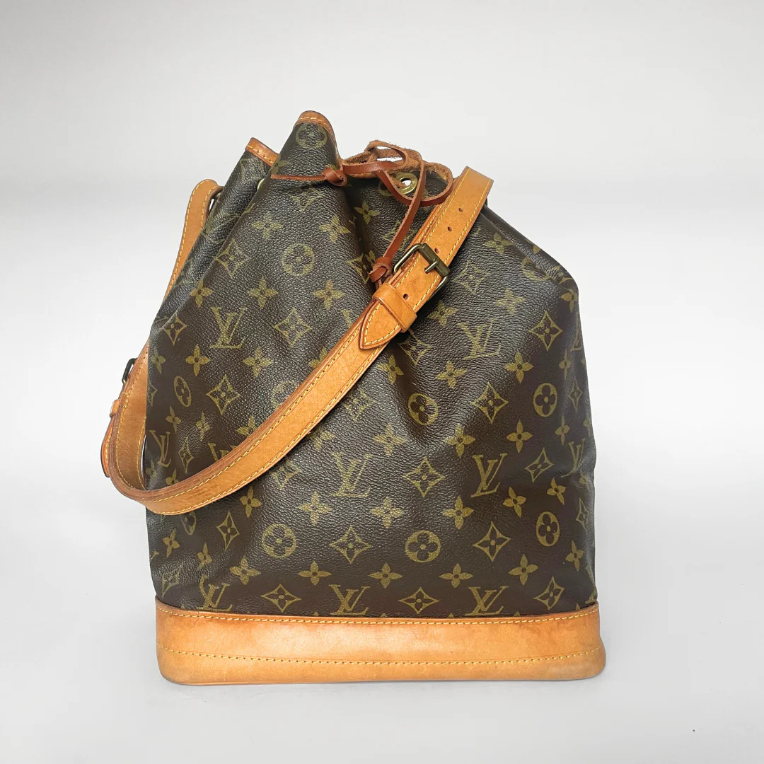 Designer handbag with monogram pattern on a white background