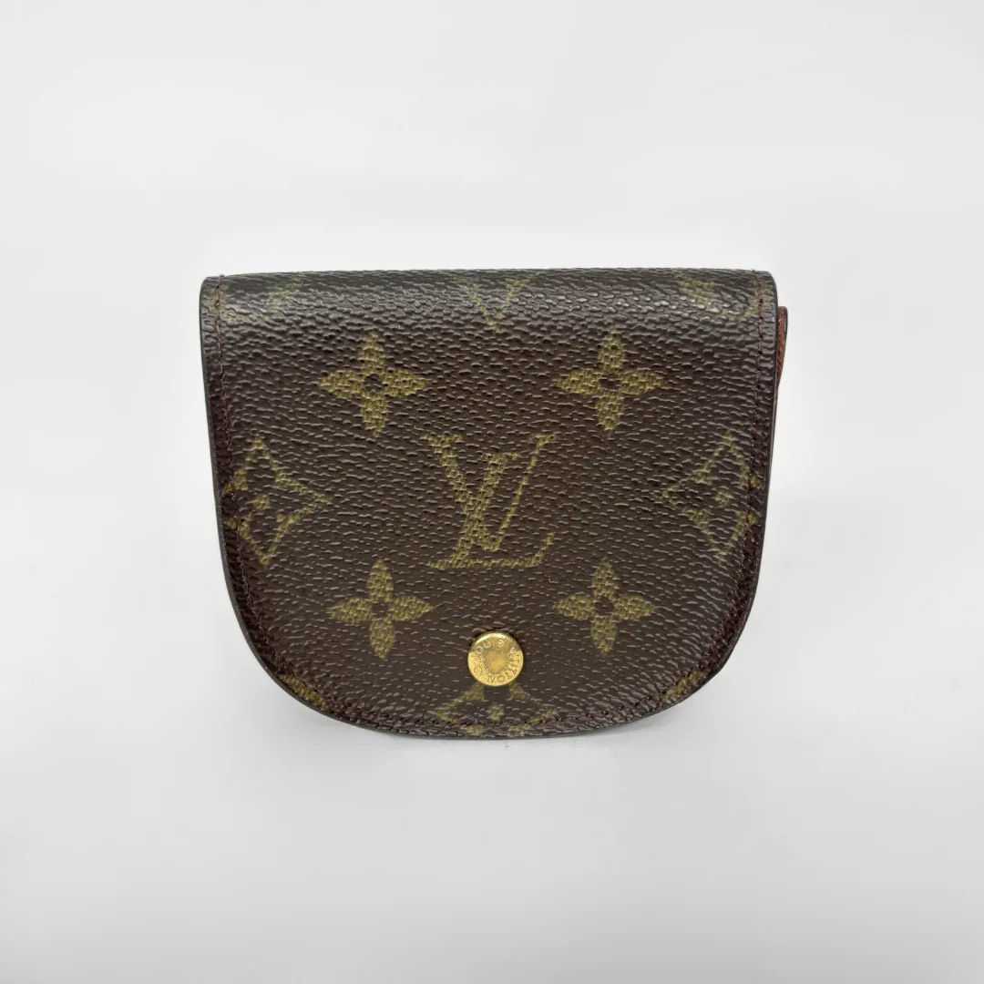 Louis Vuitton monogram wallet on a white background