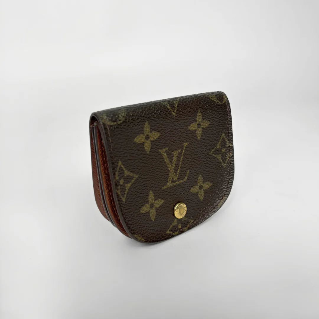 Louis Vuitton monogram wallet on a white background