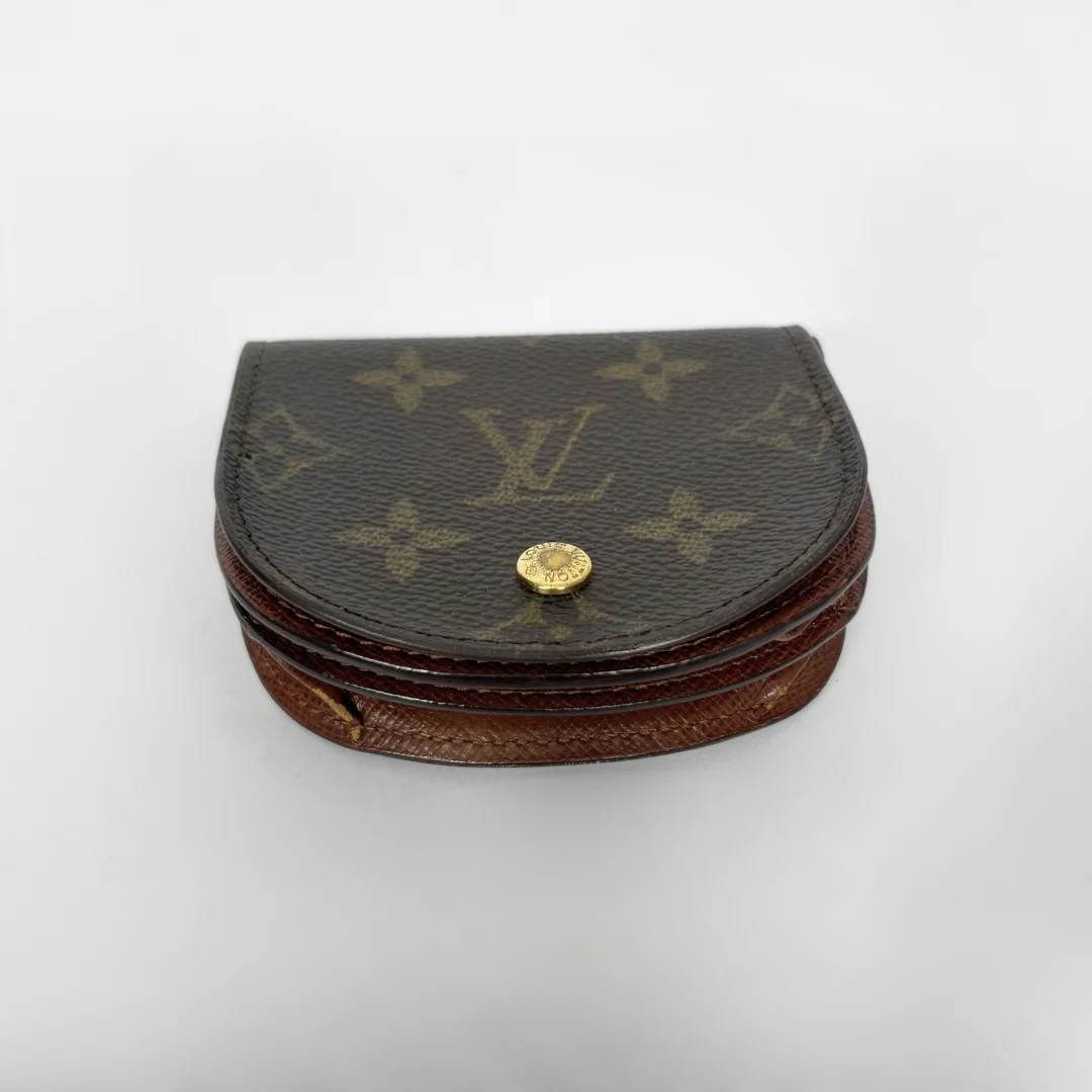 Louis Vuitton monogrammed jewelry box on a white background