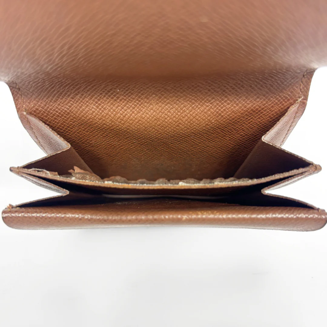 Close-up of a brown leather wallet on a white background