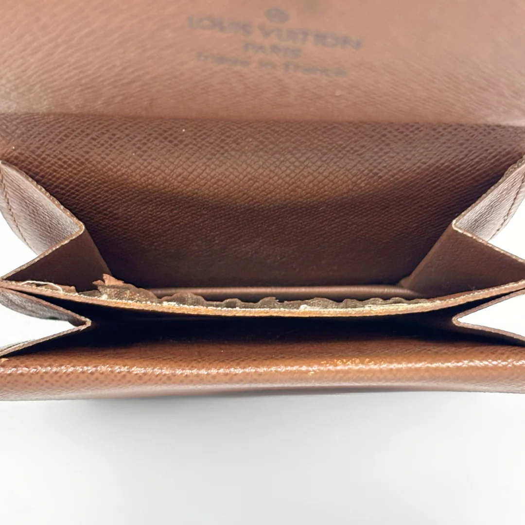 Close-up of a brown leather Louis Vuitton handbag on a white background