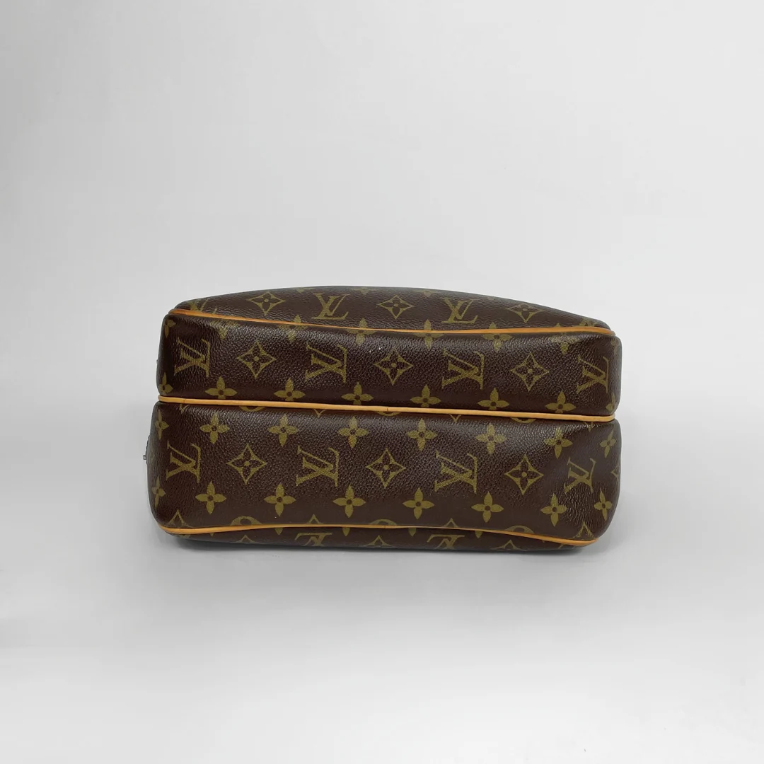 Louis Vuitton Reporter PM Monogram Canvas on a white background