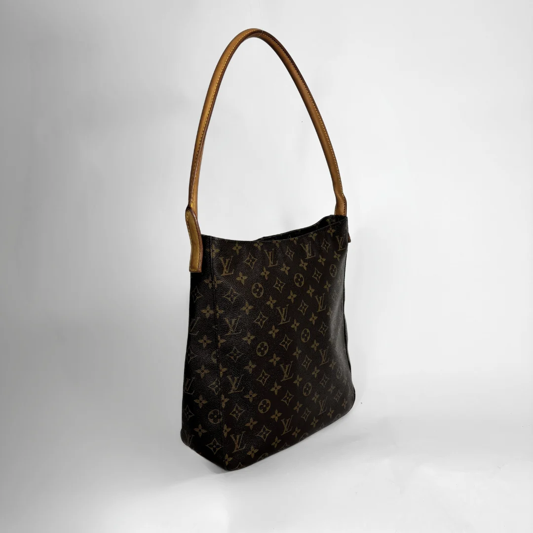 A Louis Vuitton shoulder bag in the classic brown monogram canvas with tan leather shoulder straps, shown on a light gray background.