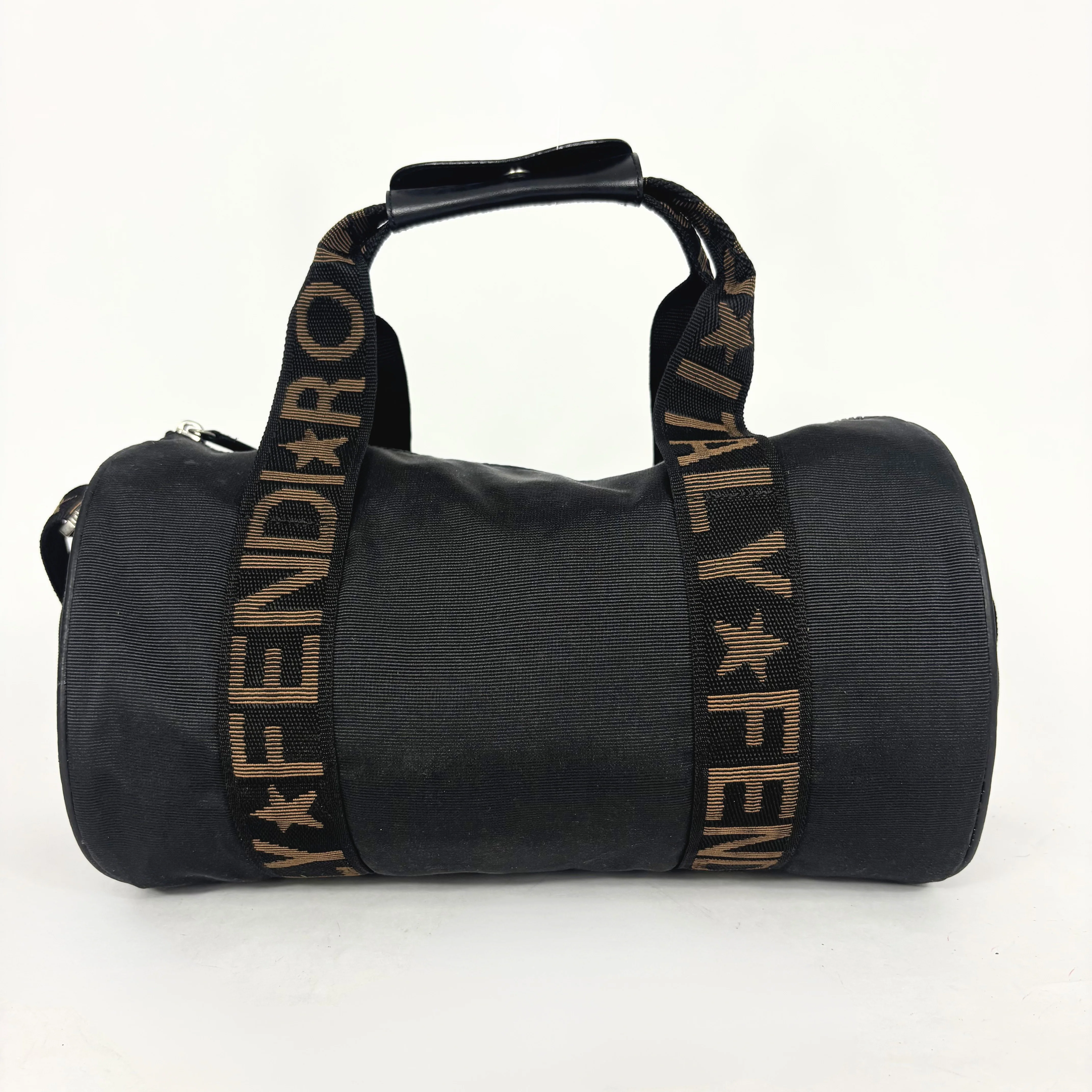 Black duffel bag with 'FENDI' logo on a white background