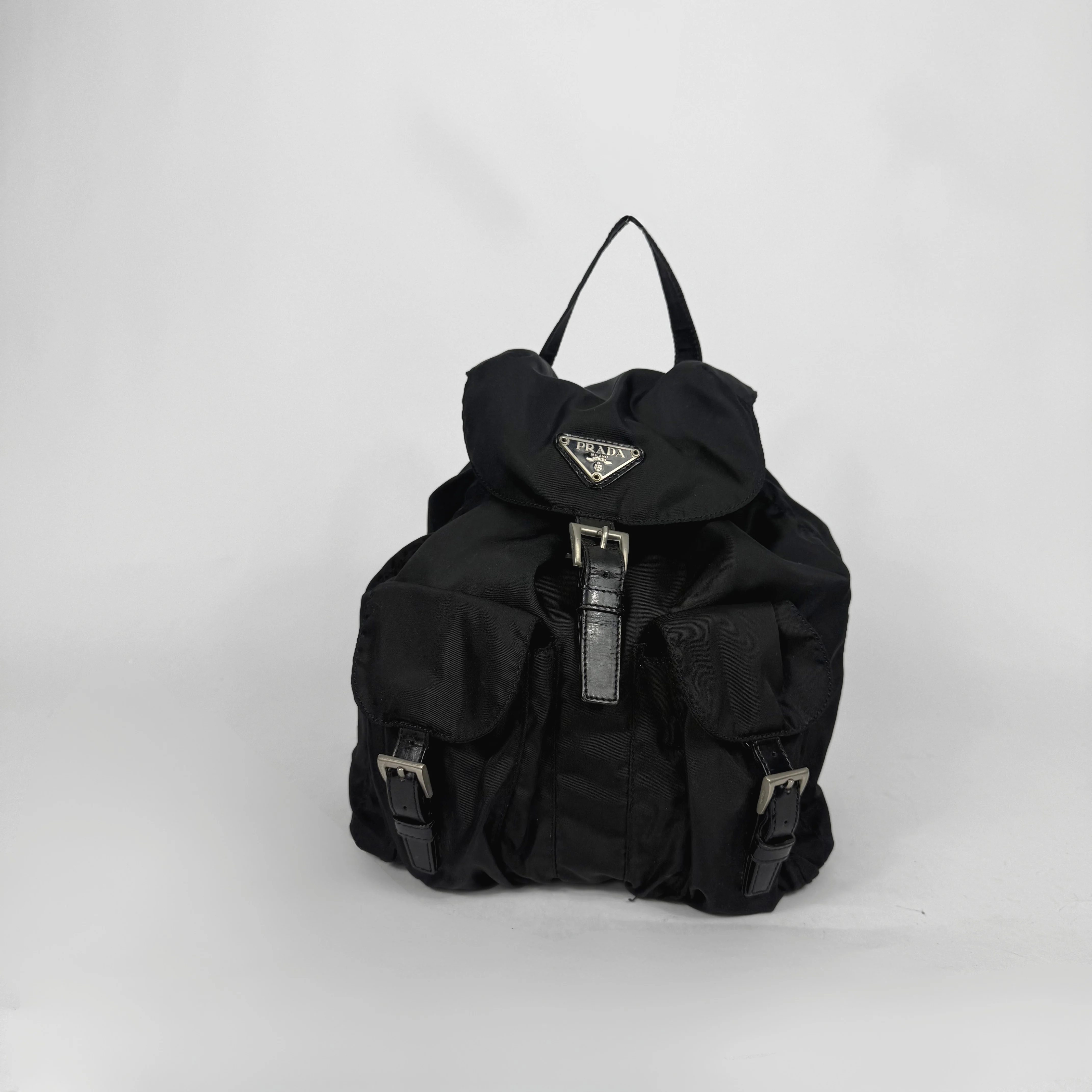 Black backpack with a brand logo on a white background