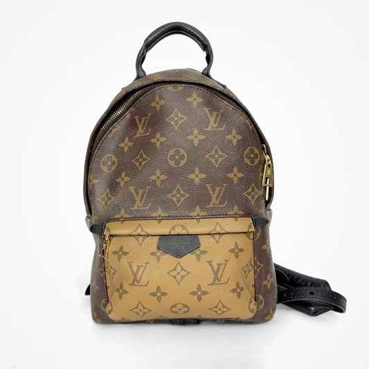 Louis Vuitton backpack with monogram pattern on a white background