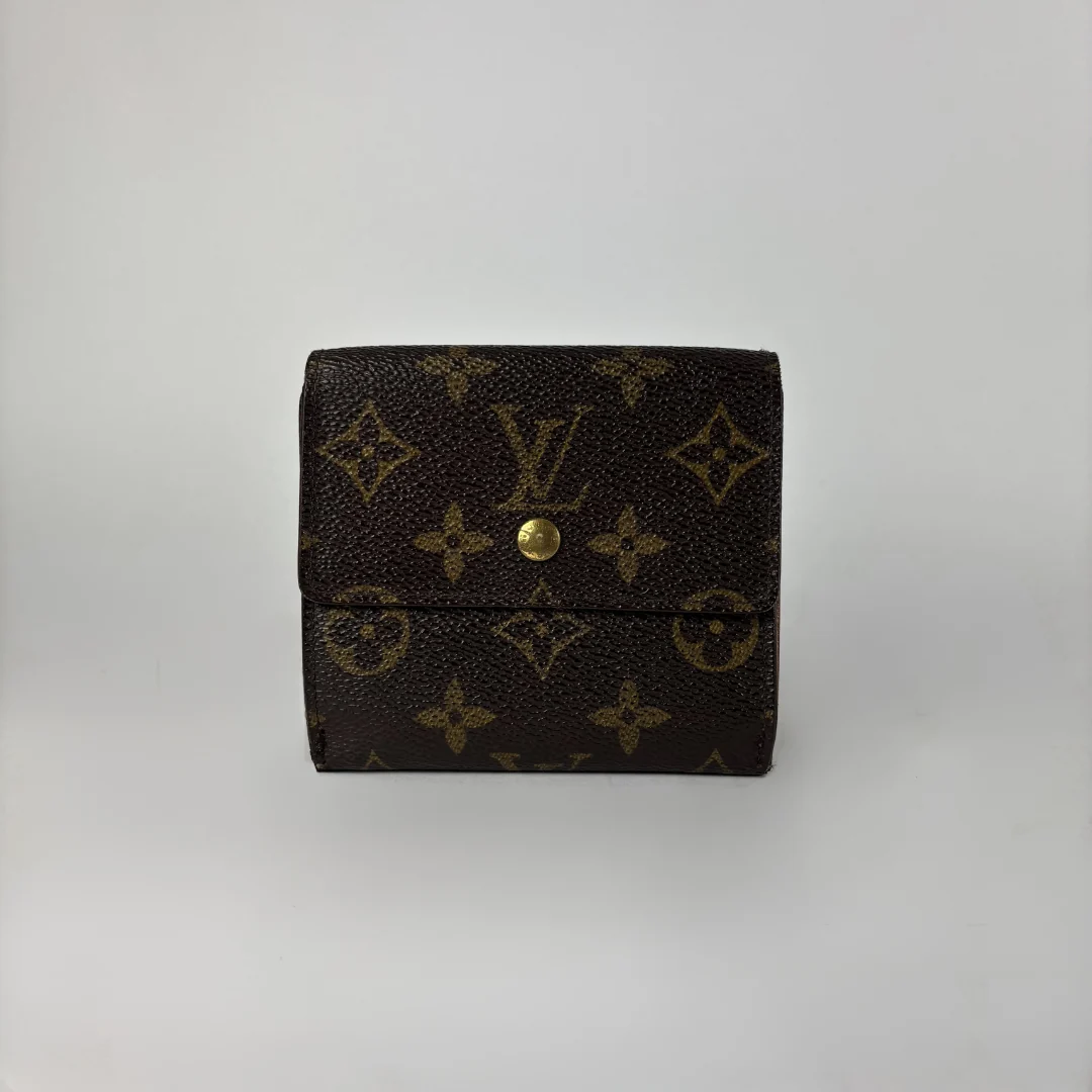A Louis Vuitton monogram canvas bi-fold wallet in dark brown with gold-tone hardware, photographed against a neutral light gray background.