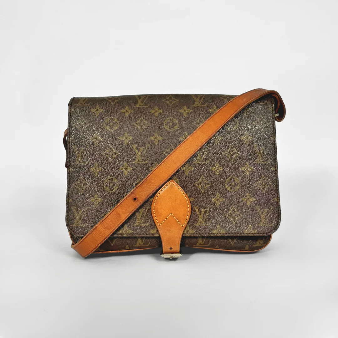 Brown Louis Vuitton bag with monogram pattern on a white background