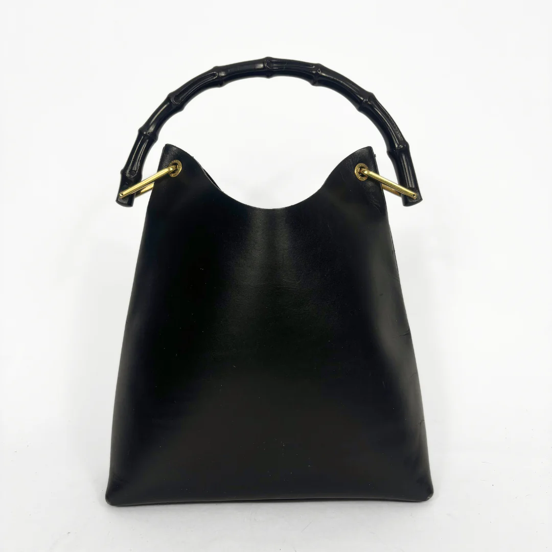 Gucci vintage black leather hobo hag with a dark wood bamboo top handle and gold-tone hardware.