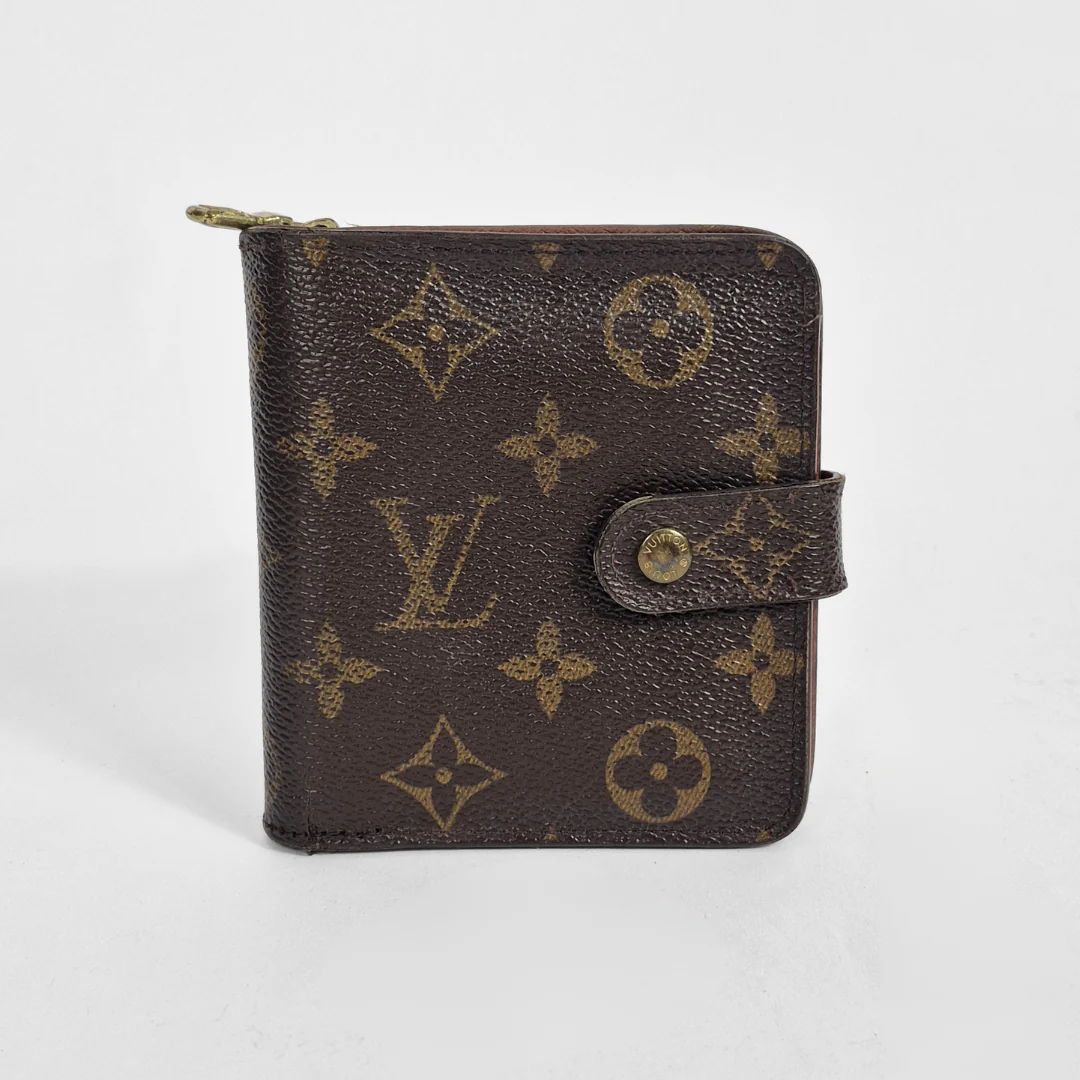 Louis Vuitton wallet with monogram pattern on a white background