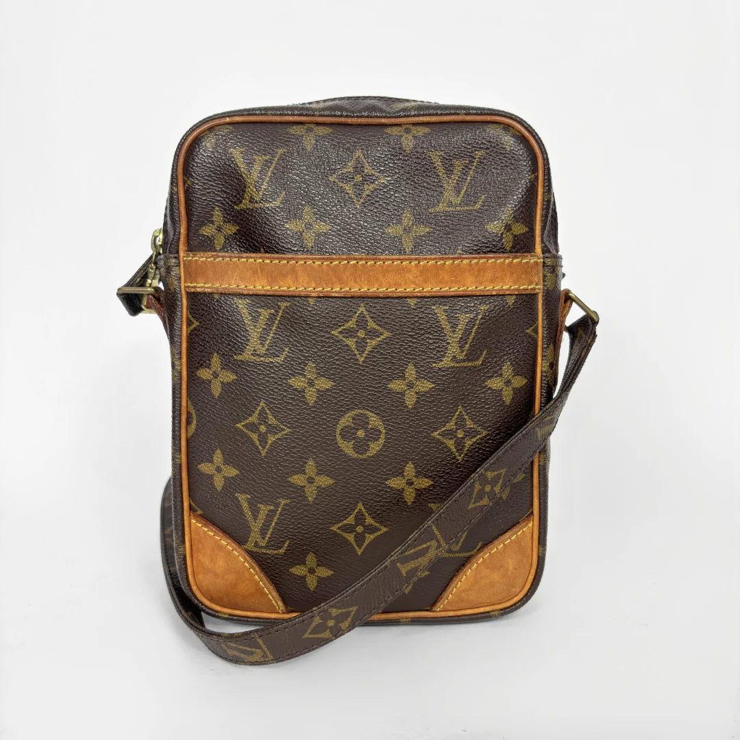 Brown leather bag with visible brand logo on a white background