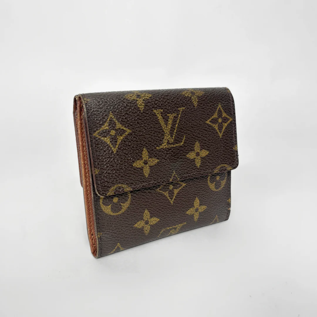 Louis Vuitton wallet with monogram pattern on a white background