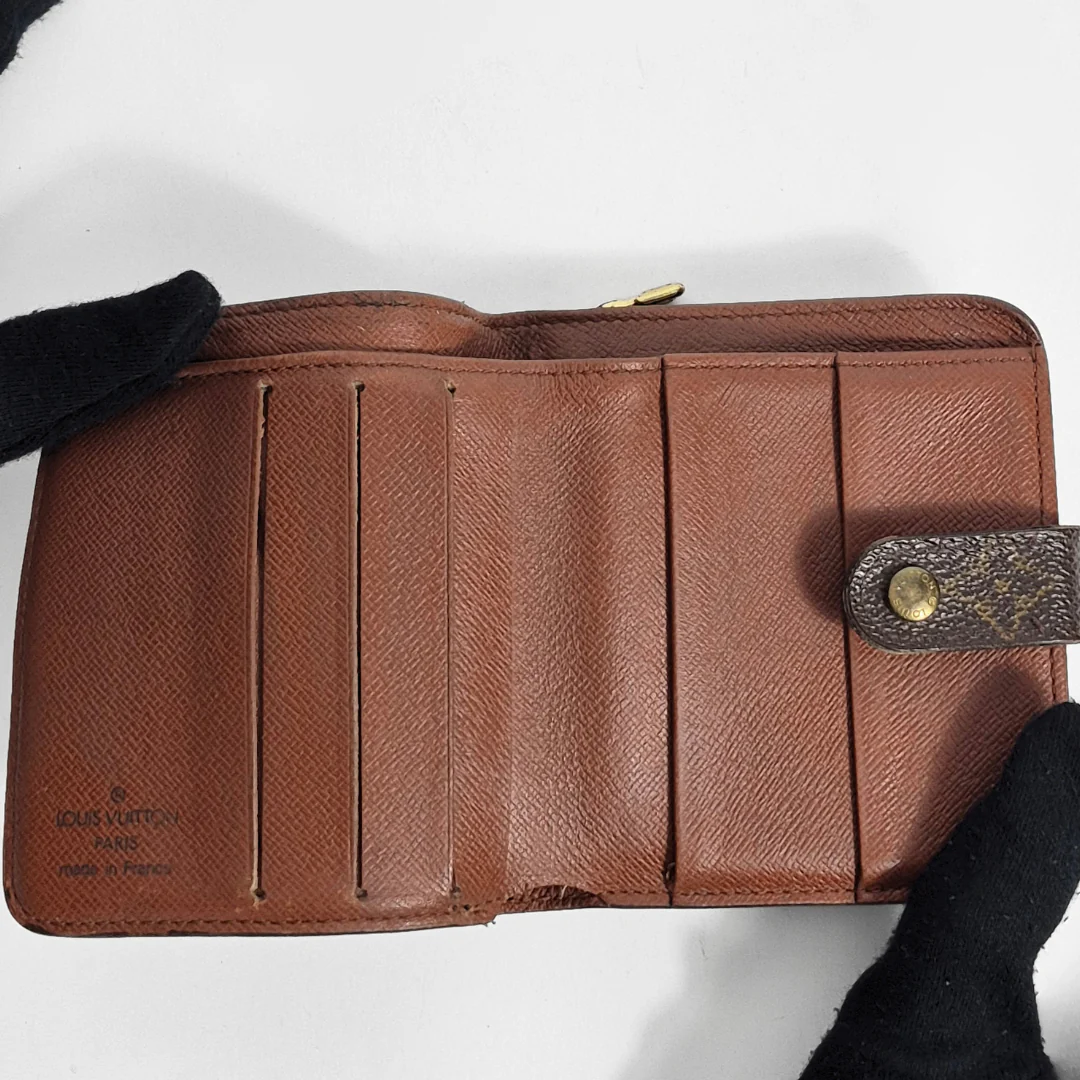 Brown leather wallet with visible brand logo on a white background